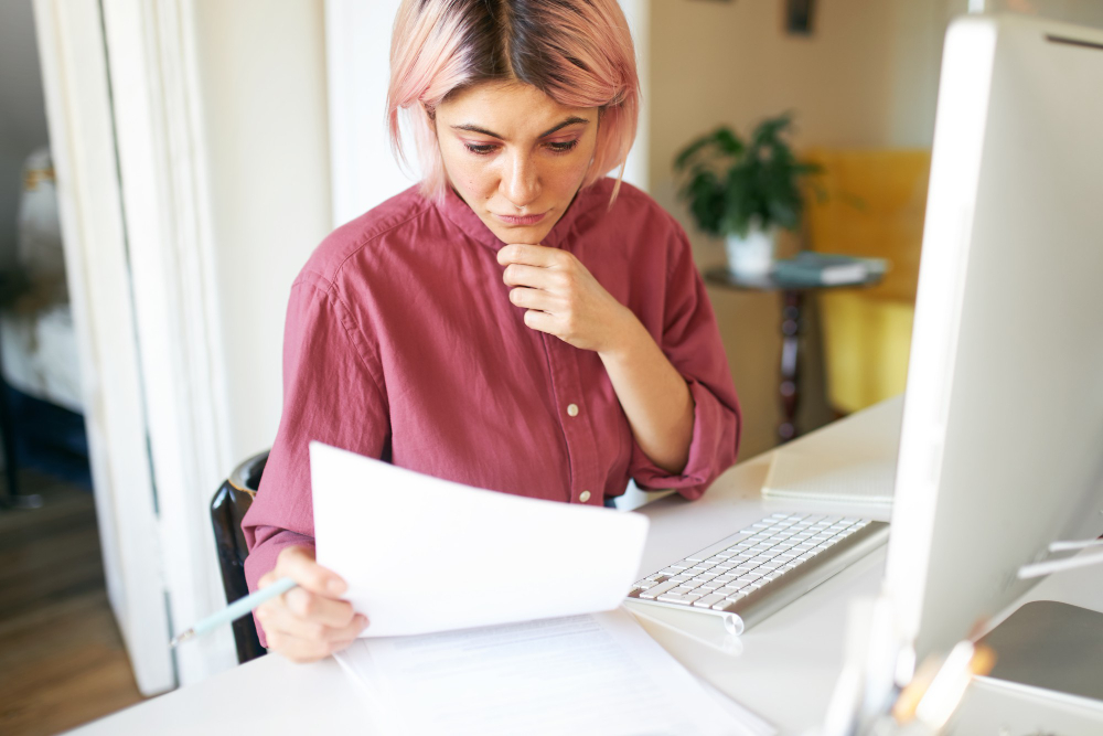 a young woman reviewing her report